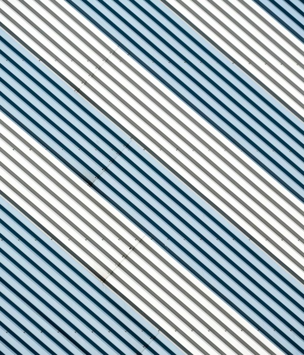 Abstract diagonal stripes in metallic tones create a dynamic modern design.