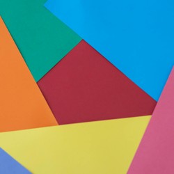 A creative arrangement of colorful paper sheets in lively hues.
